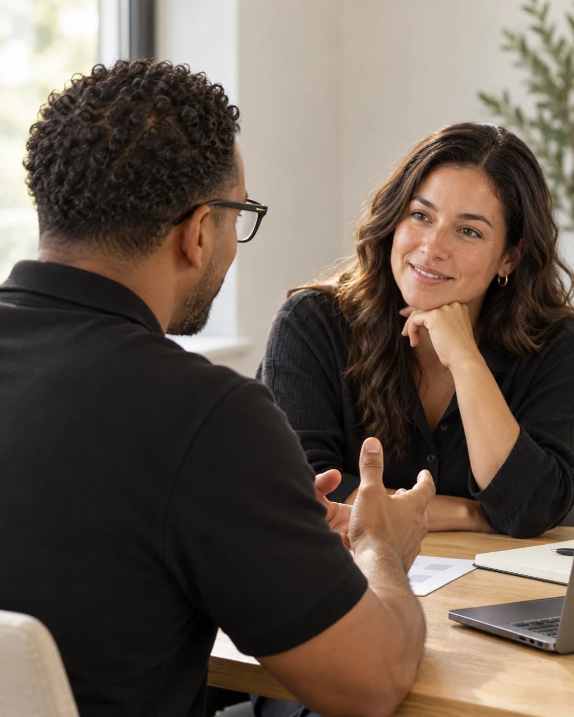 A leader and an advisor talking through a decision across a table